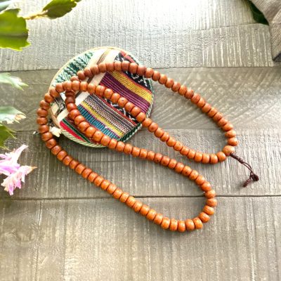 Hand-strung 108 bead dark Bodhi seeds mala on heavy cotton cord with guru bead and simple knot, handmade in Kathmandu, Nepal.