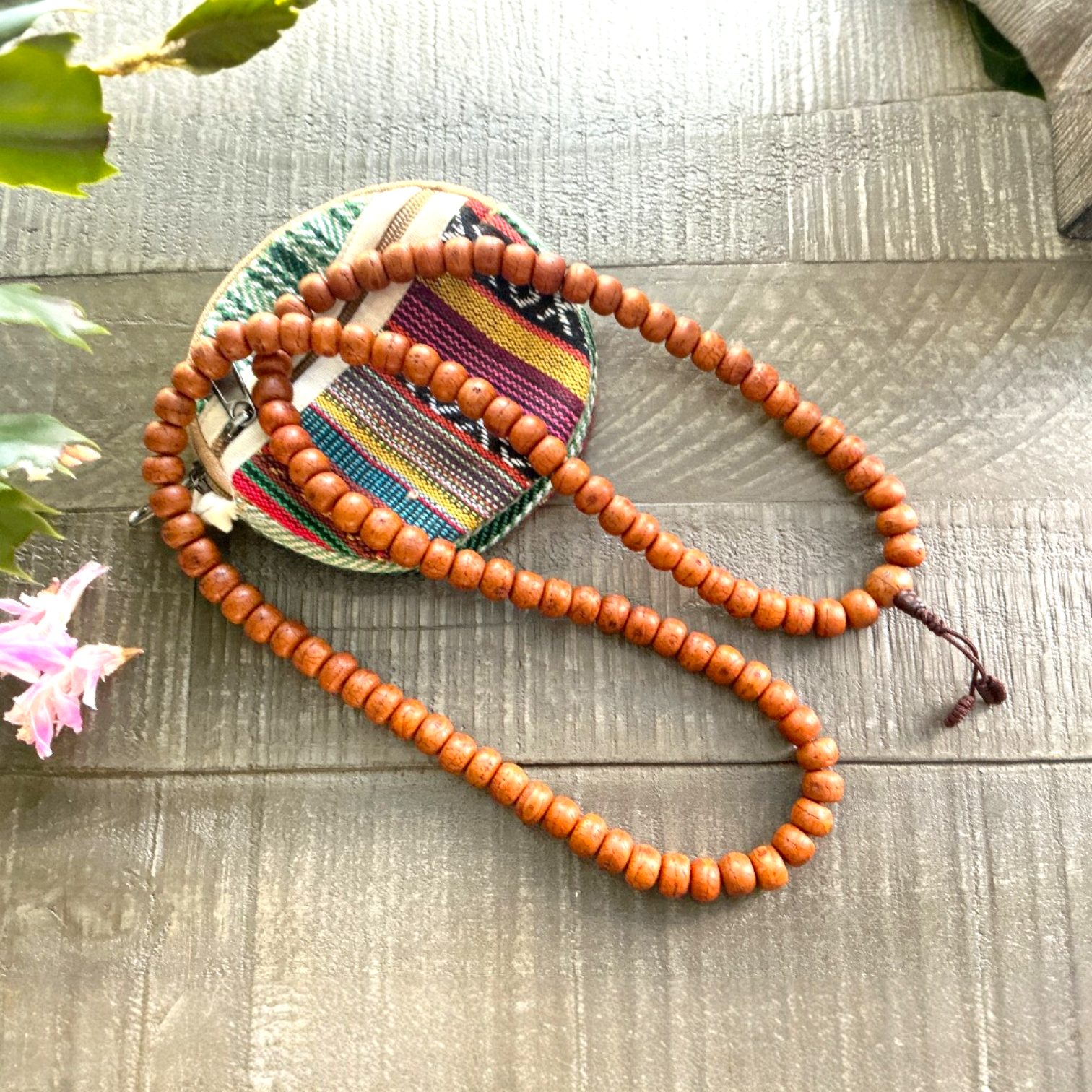 Hand-strung 108 bead dark Bodhi seeds mala on heavy cotton cord with guru bead and simple knot, handmade in Kathmandu, Nepal.